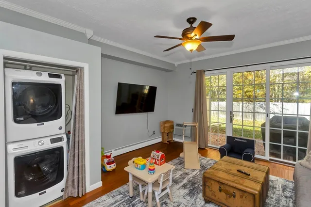 a living room with furniture tv and a fireplace