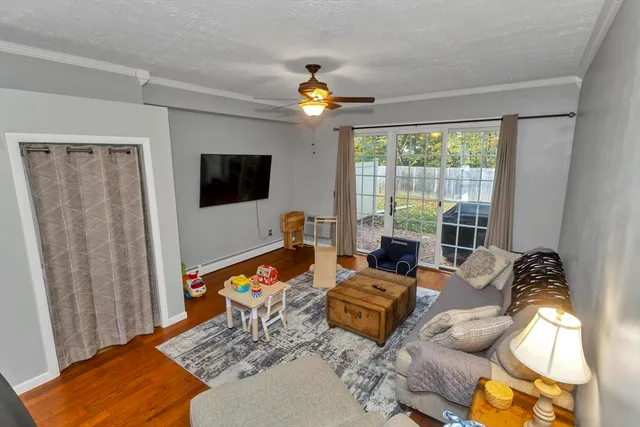a bedroom with furniture and a flat screen tv