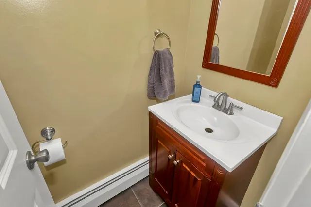 a bathroom with a sink and a mirror