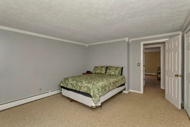 a room with a bed and a night stand