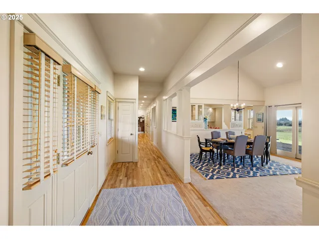 a dining room with furniture and wooden floor