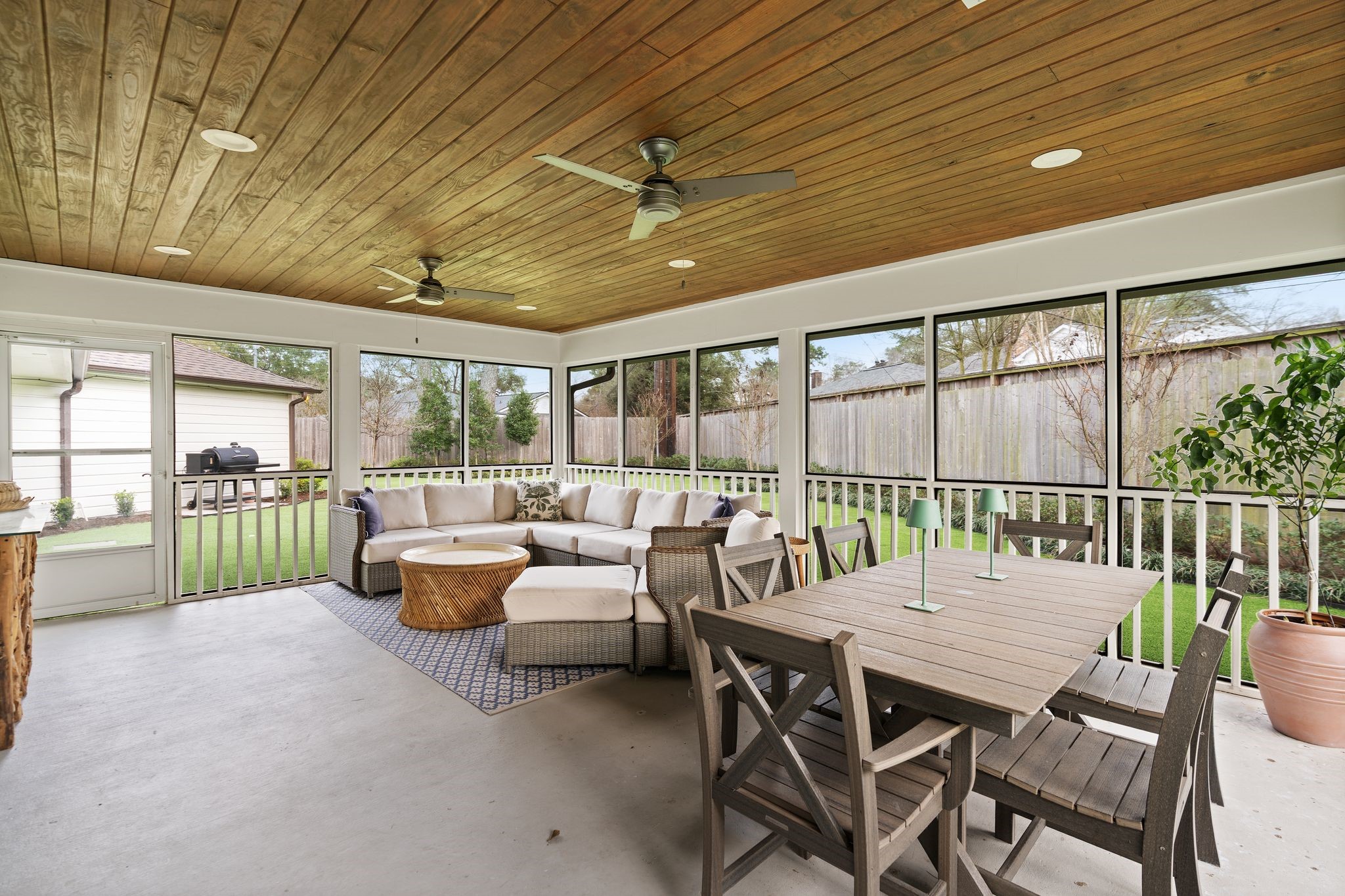 4902 Candleleaf Drive Houston, TX 77018 - Photo 12 of 32 The screened porch extends the living space outdoors and invites slow mornings or relaxed evenings.