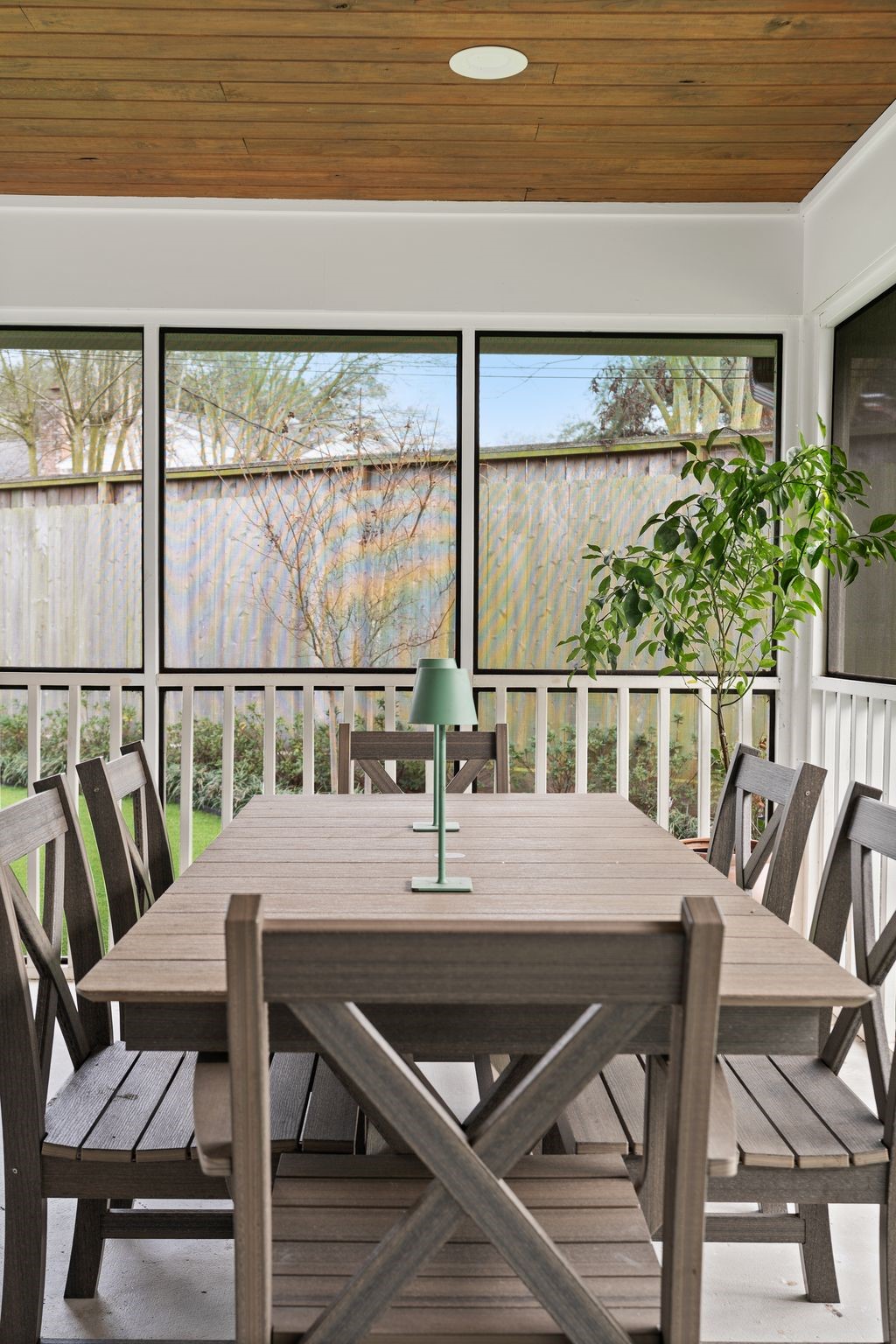 4902 Candleleaf Drive Houston, TX 77018 - Photo 13 of 32 The screened porch overlooks the backyard and extends the living space outdoors.