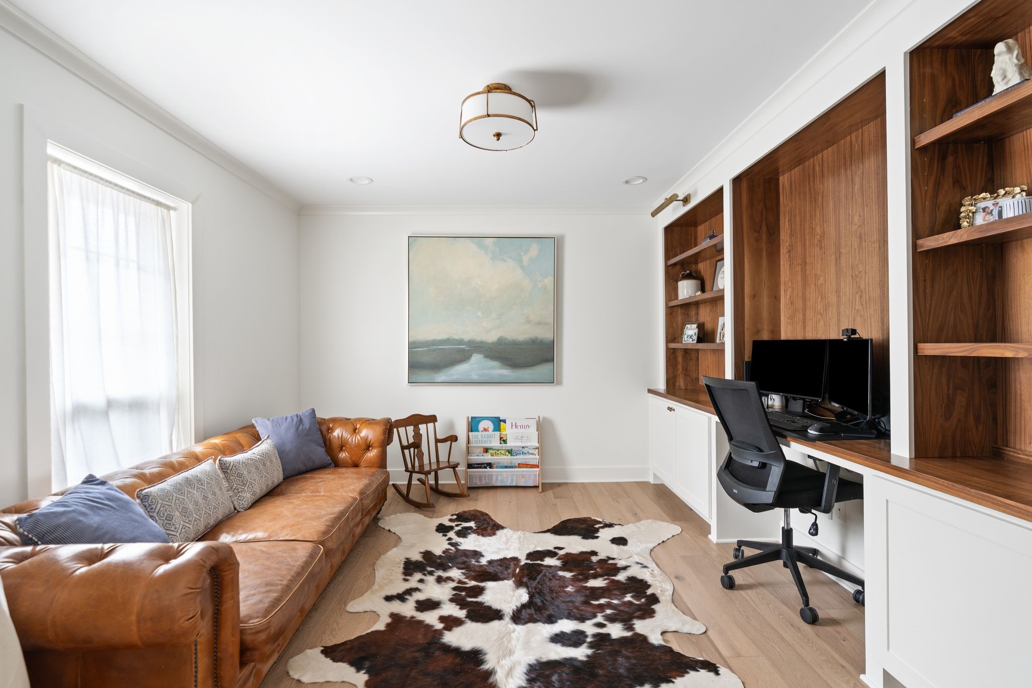 4902 Candleleaf Drive Houston, TX 77018 - Photo 16 of 32 Tucked behind pocket doors off the dining room, the home office offers a quiet and private space with custom built-ins and beautiful natural light.