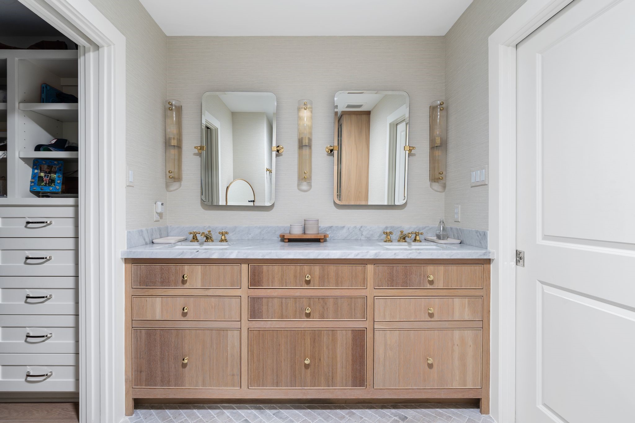 4902 Candleleaf Drive Houston, TX 77018 - Photo 18 of 32 The primary bath features furniture-style cabinetry and warm finishes that give the space a tailored, custom feel.