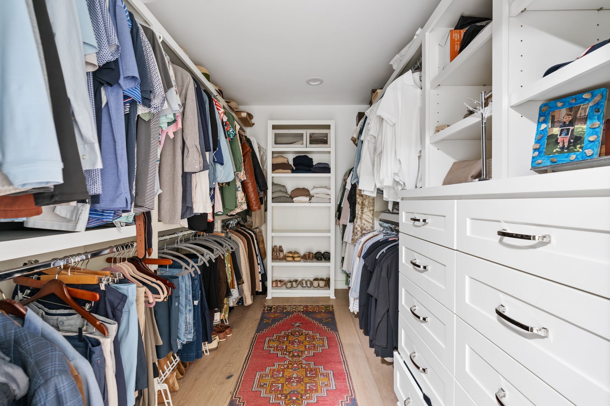 4902 Candleleaf Drive Houston, TX 77018 - Photo 20 of 32 The walk-in closet features built-in drawers along with dedicated storage for shoes and accessories, keeping everything organized and within easy reach.