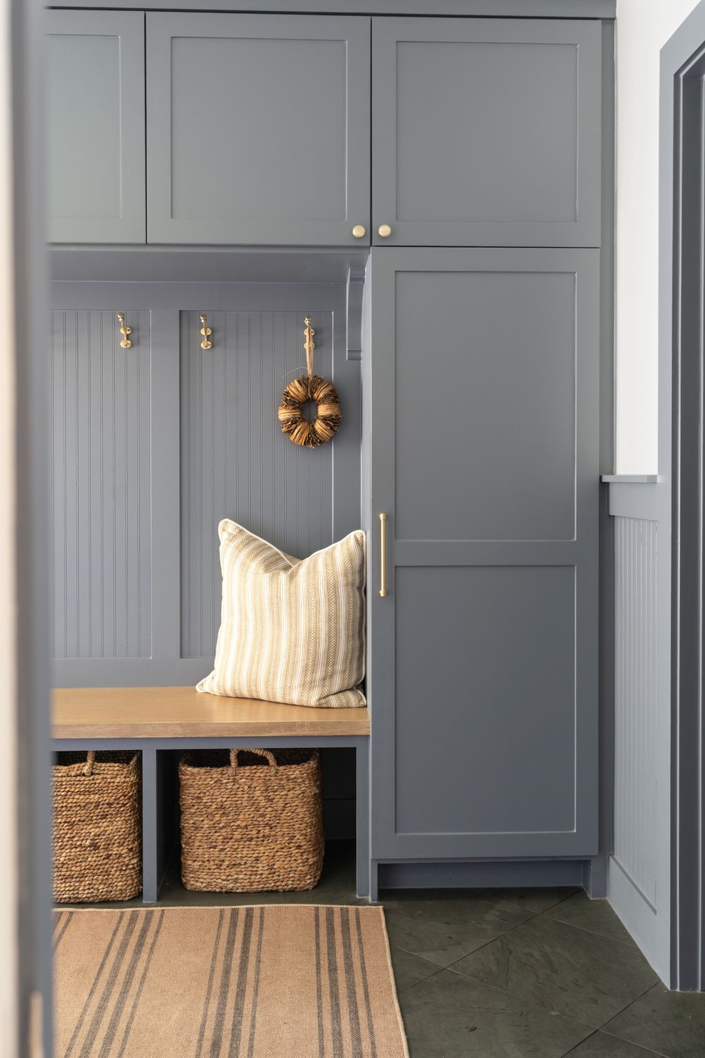 4902 Candleleaf Drive Houston, TX 77018 - Photo 24 of 32 Shiplap accents and a bold statement color give the mudroom personality while keeping the space practical and well organized.