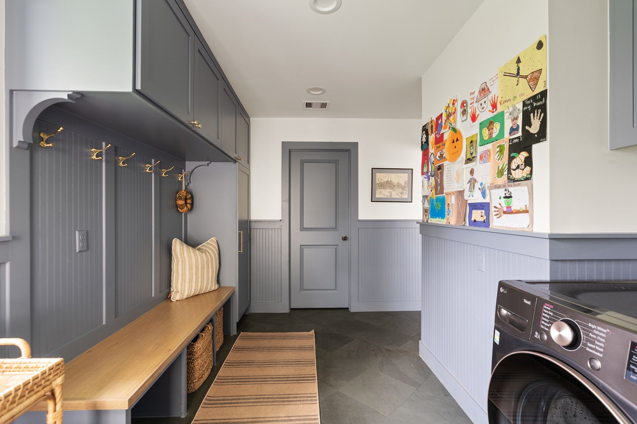 4902 Candleleaf Drive Houston, TX 77018 - Photo 25 of 32 The spacious mudroom combines the utility area with built-in organization for backpacks, coats, and shoes, along with a bench for easy drop-and-go living.