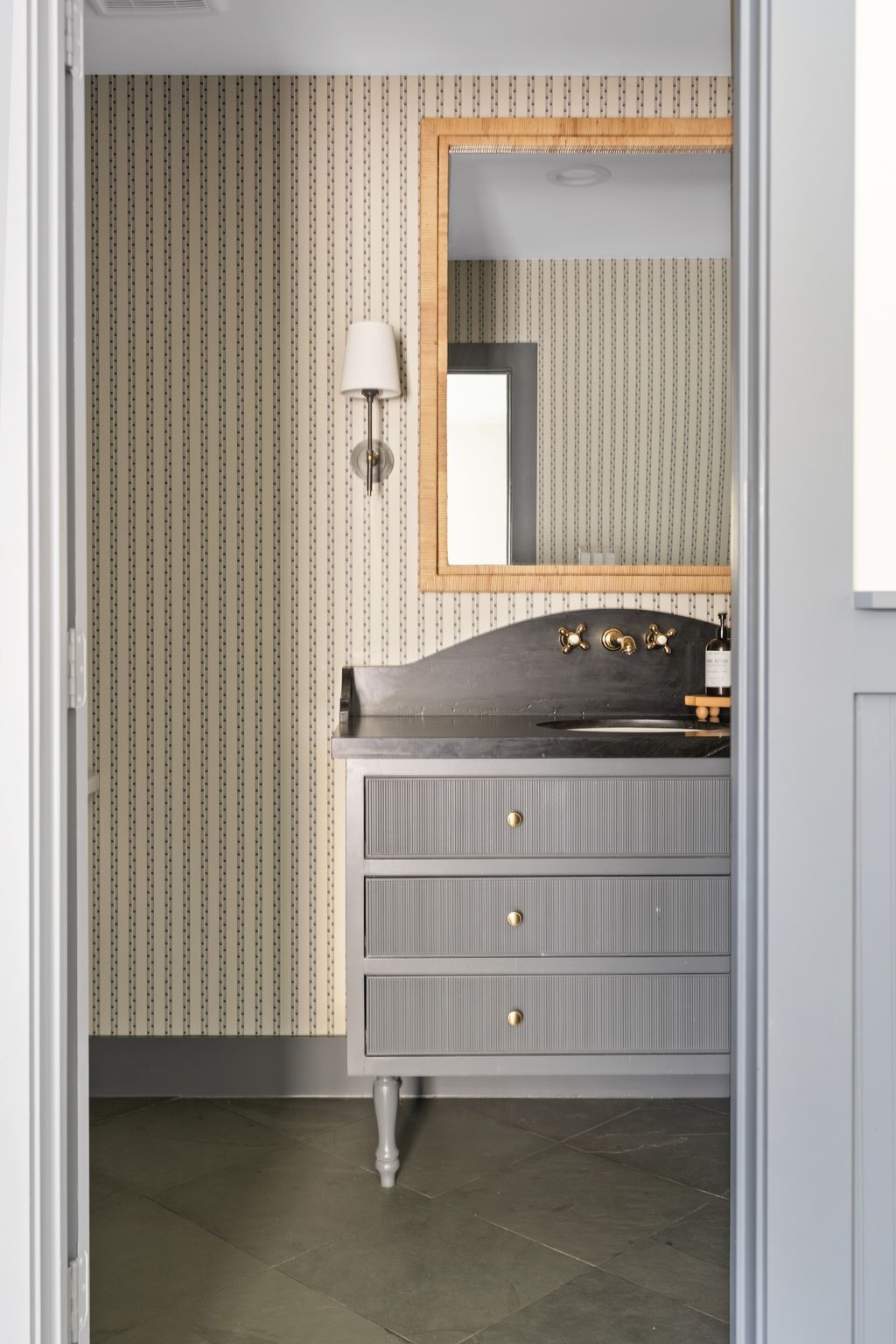 4902 Candleleaf Drive Houston, TX 77018 - Photo 26 of 32 Layered with Schumacher wallpaper and a furniture-style vanity, the powder bath delivers a small but memorable design moment.