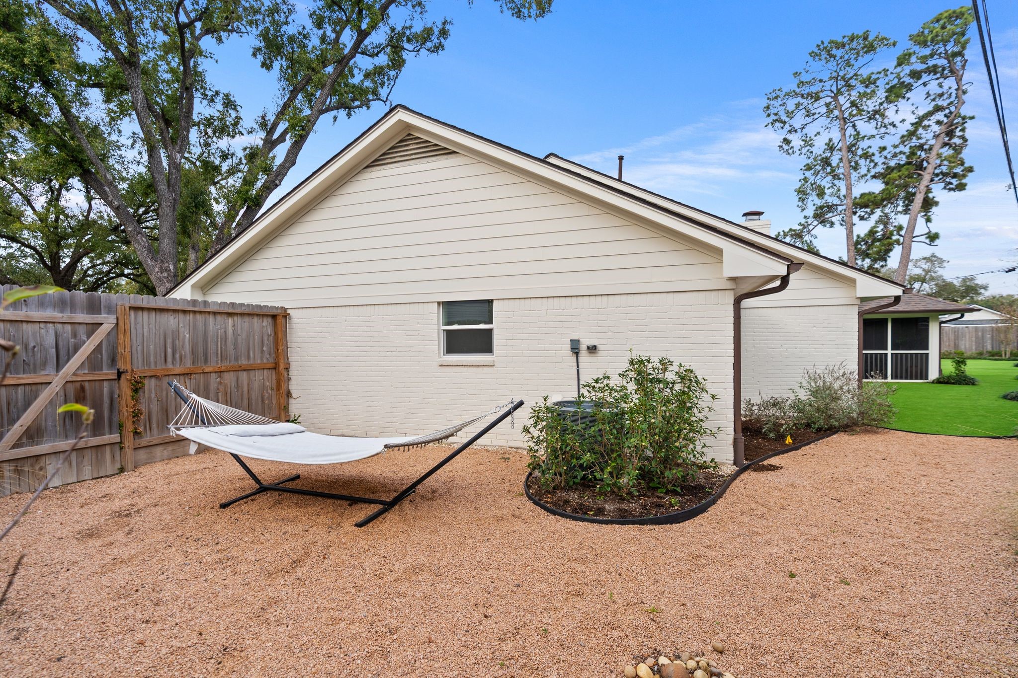 4902 Candleleaf Drive Houston, TX 77018 - Photo 27 of 32 The side yard features a gravel garden and improved drainage designed for both beauty and function.
