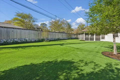a view of a backyard with plants and garden