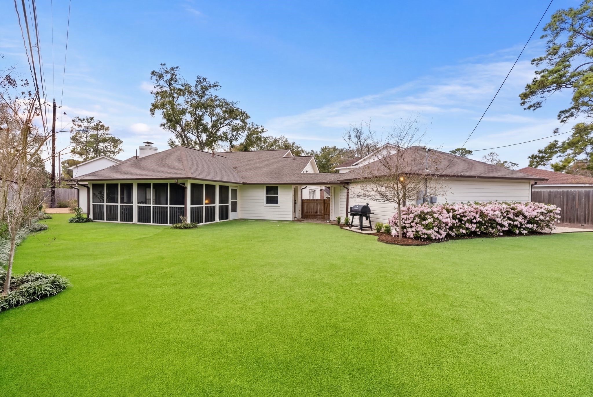 4902 Candleleaf Drive Houston, TX 77018 - Photo 3 of 32 The rear of the home opens to a screened porch and turfed backyard designed for easy outdoor living.