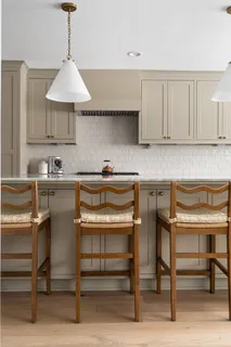 a kitchen with a sink cabinets and window