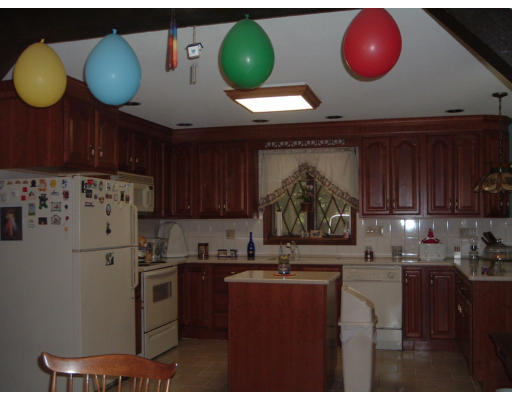 30 Old Wales Road Monson, MA 01057 - Photo 3 of 15 a kitchen with a refrigerator and a stove