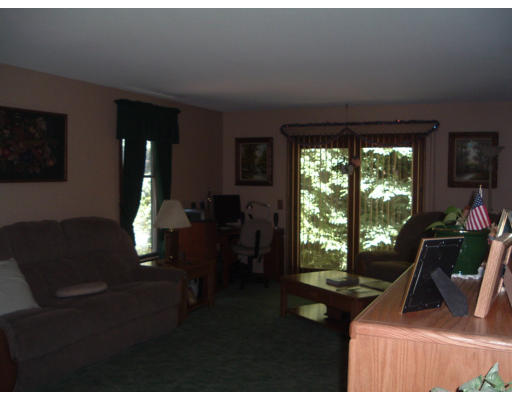 30 Old Wales Road Monson, MA 01057 - Photo 7 of 15 a view of a livingroom with furniture wooden floor and a floor to ceiling window