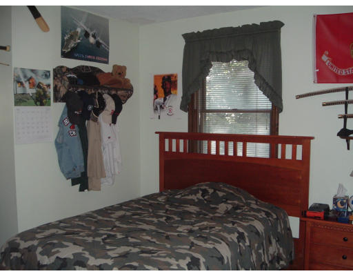 30 Old Wales Road Monson, MA 01057 - Photo 10 of 15 a bedroom with a bed and wall painting