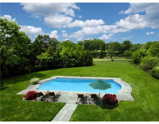 154 Stanwich Road Greenwich, CT 06830 - Photo 11 of 13 a view of a backyard with swimming pool and green space