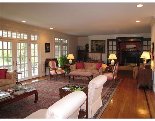 154 Stanwich Road Greenwich, CT 06830 - Photo 4 of 13 a living room with furniture fireplace and large windows