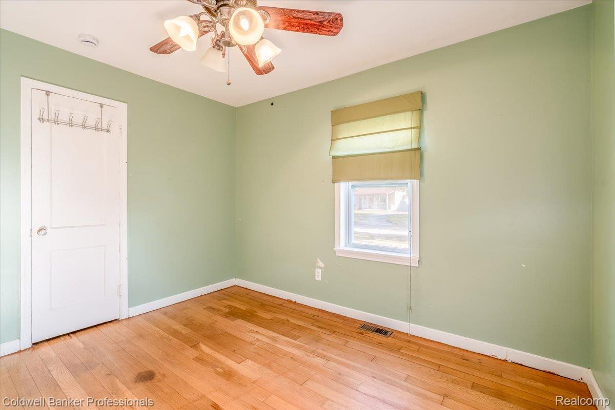 3582 Swanson Street Wayne, MI 48184 - Photo 16 of 30 Spare room with hardwood / wood-style floors and a ceiling fan
