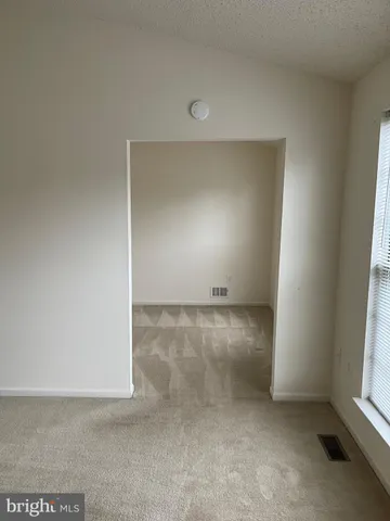 a spacious bathroom with a double vanity sink a large mirror and shower