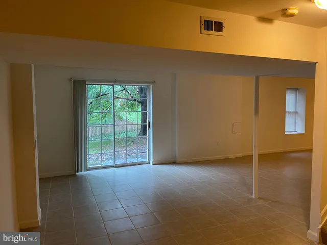 a view of a porch with wooden floor