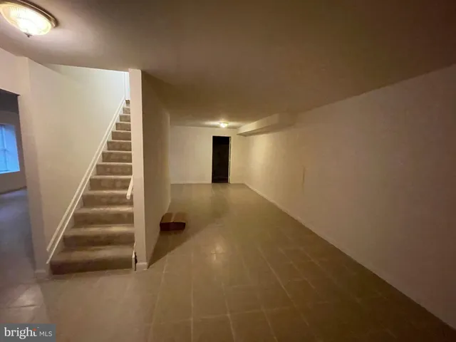 a view of a house with backyard and deck