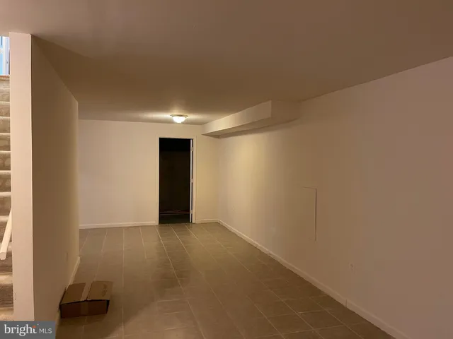a view of a roof deck with wooden fence and floor