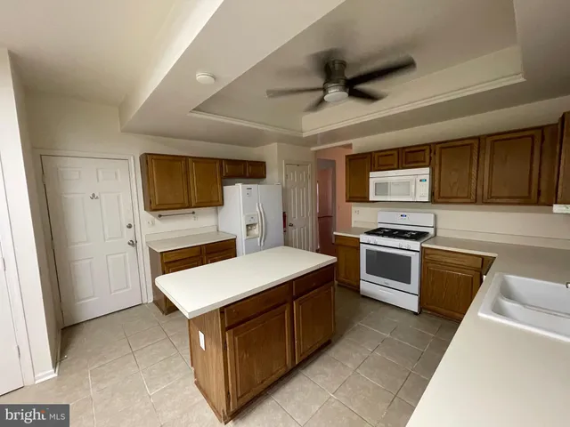 a kitchen with a stove microwave and refrigerator