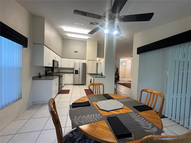 a kitchen with a stove a sink and a refrigerator