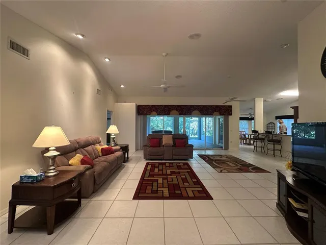 a living room with furniture and a table