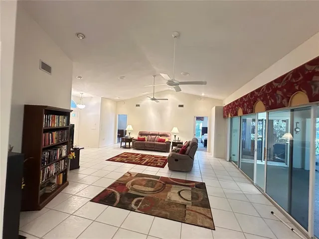 a kitchen with stainless steel appliances granite countertop a sink refrigerator and cabinets