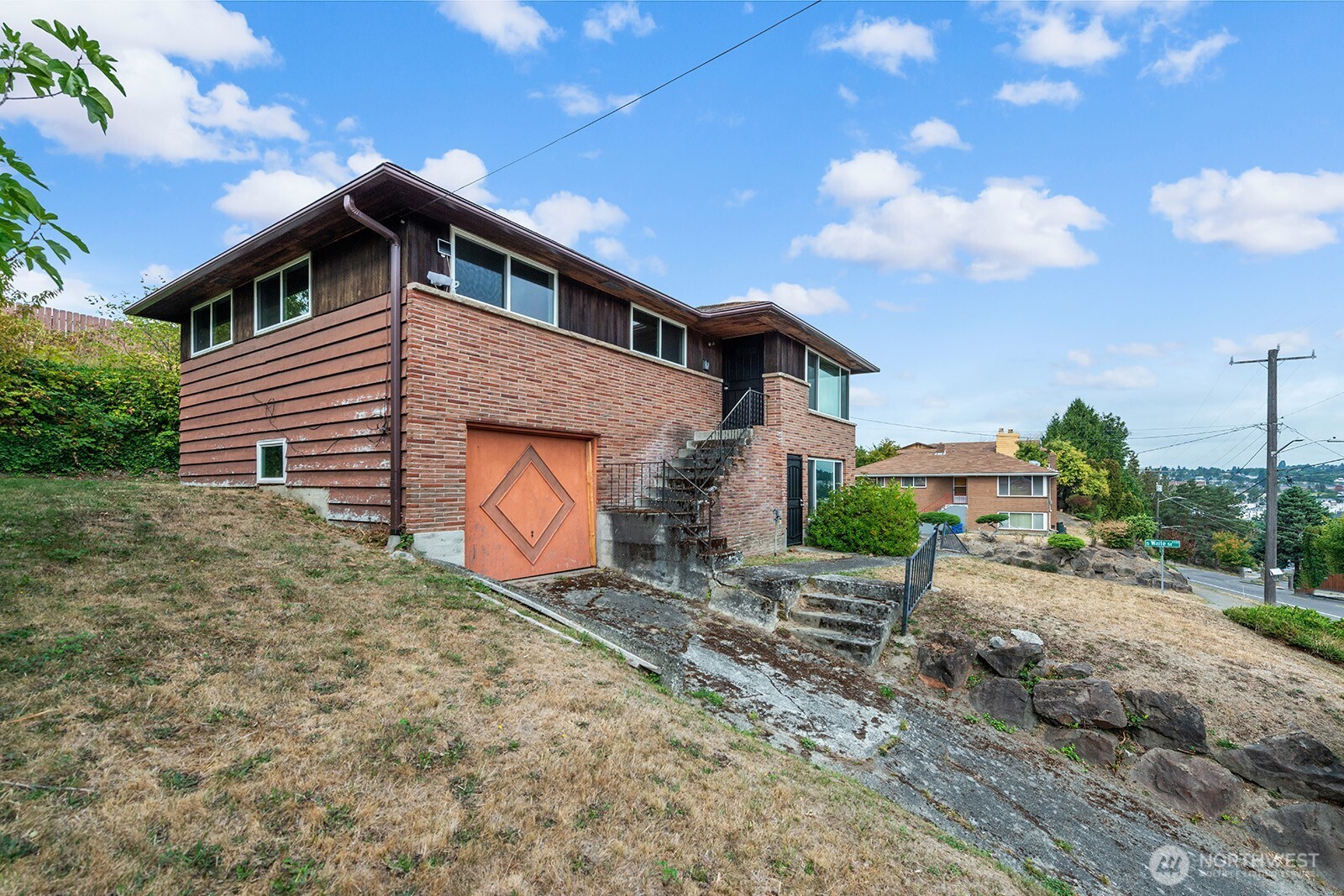 2601 23rd Avenue South Seattle, WA 98144 - Photo 5 of 13 a front view of a house with a yard and garage