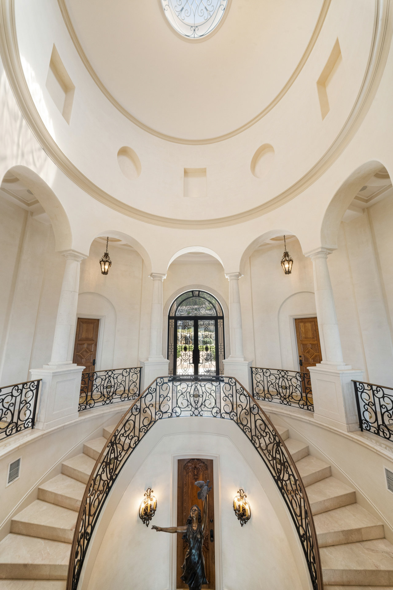 12821 Hughes Park Road Austin, TX 78732 - Photo 14 of 39 The home boasts impressive features such as marble and herringbone wood floors, antique wood fireplaces, wood shutters, and a rotunda foyer with a double staircase.