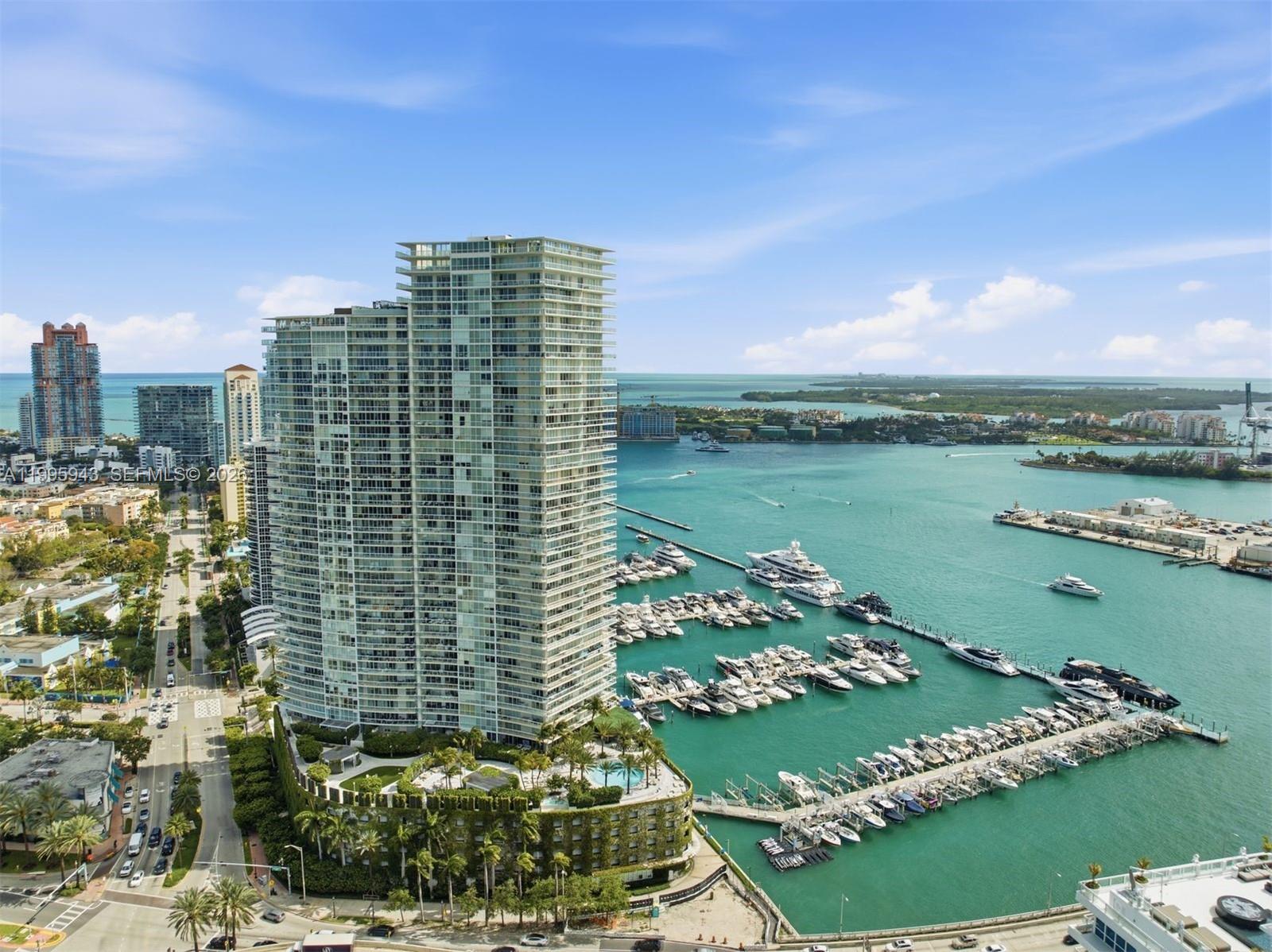 450 Alton Road, Unit 910 Miami Beach, FL 33139 - Photo 40 of 59 a view of a lake with tall building