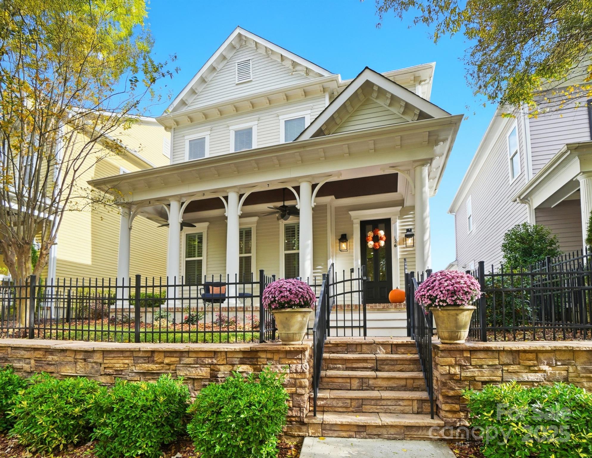 a front view of a house with garden