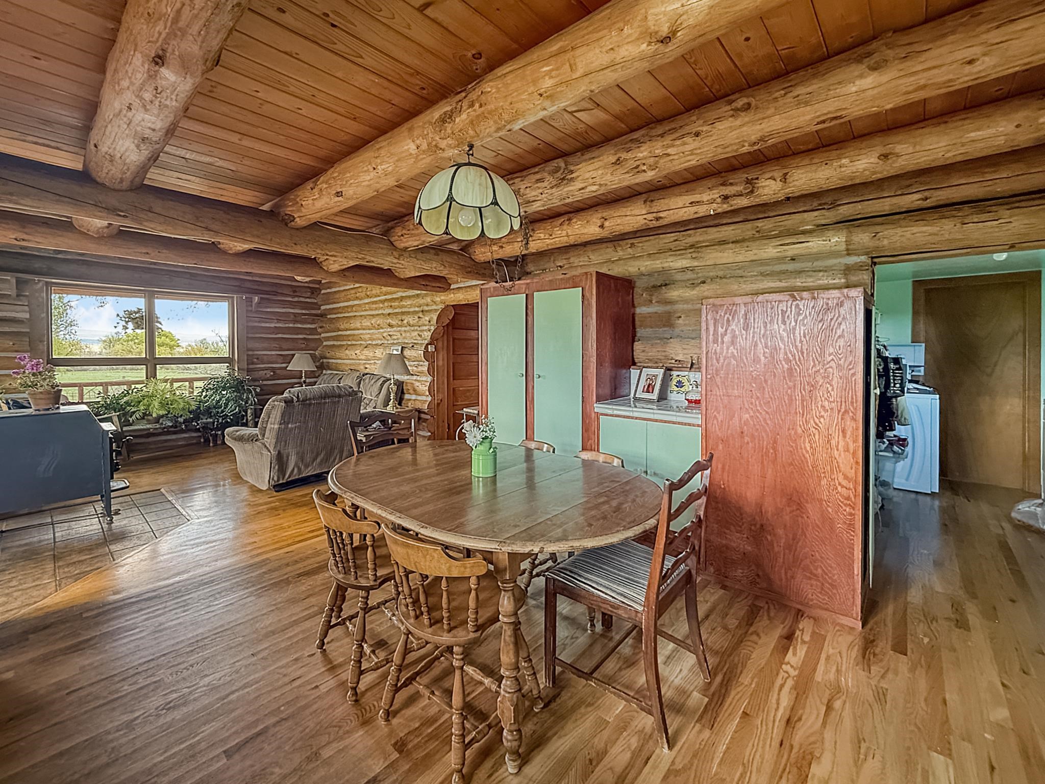 9709 3605 Road Hotchkiss, CO 81419 - Photo 13 of 42 a dining room with furniture and wooden floor