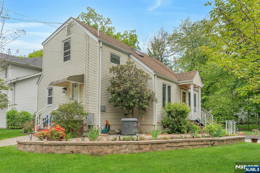 24 Cambridge Road Tenafly, NJ 07670 - Photo 29 of 31 a front view of a house with a yard