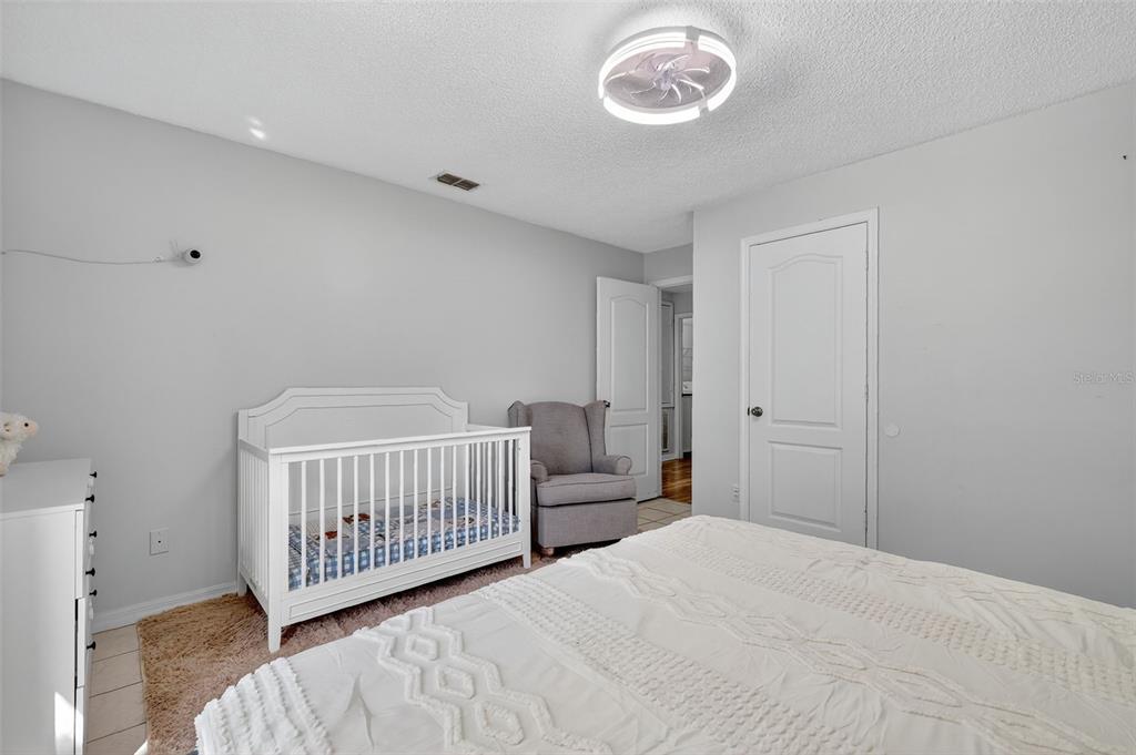 14520 Lost Lake Road Clermont, FL 34711 - Photo 45 of 54 a bedroom with a bed and a window