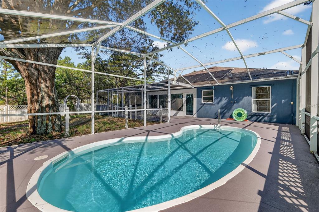 14520 Lost Lake Road Clermont, FL 34711 - Photo 49 of 54 a view of a swimming pool with a patio