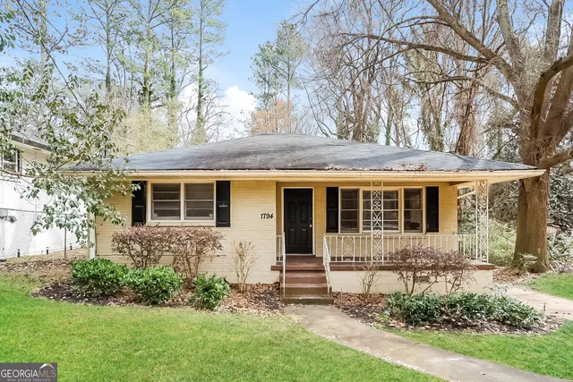 front view of a house with a yard