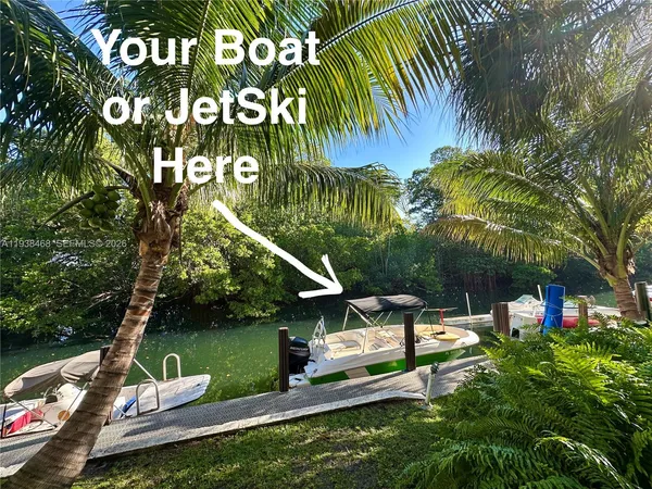 a view of a park with plants and a bench