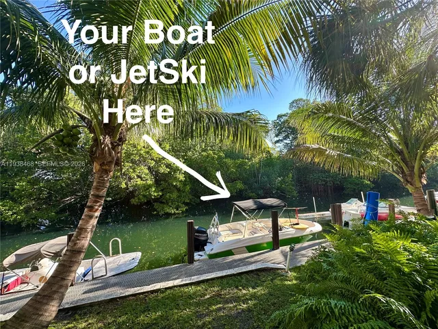 a view of a park with plants and a bench