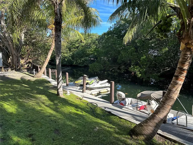 a view of a chair and table in the garden