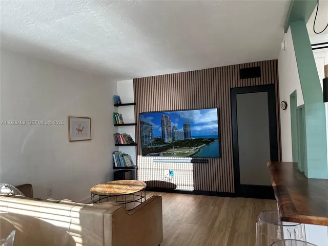 a kitchen with stainless steel appliances kitchen island granite countertop a refrigerator stove and a sink