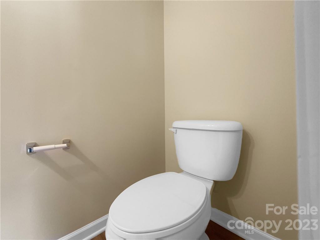 10775 Traders Court Davidson, NC 28036 - Photo 15 of 28 a white toilet sitting next to a white wall