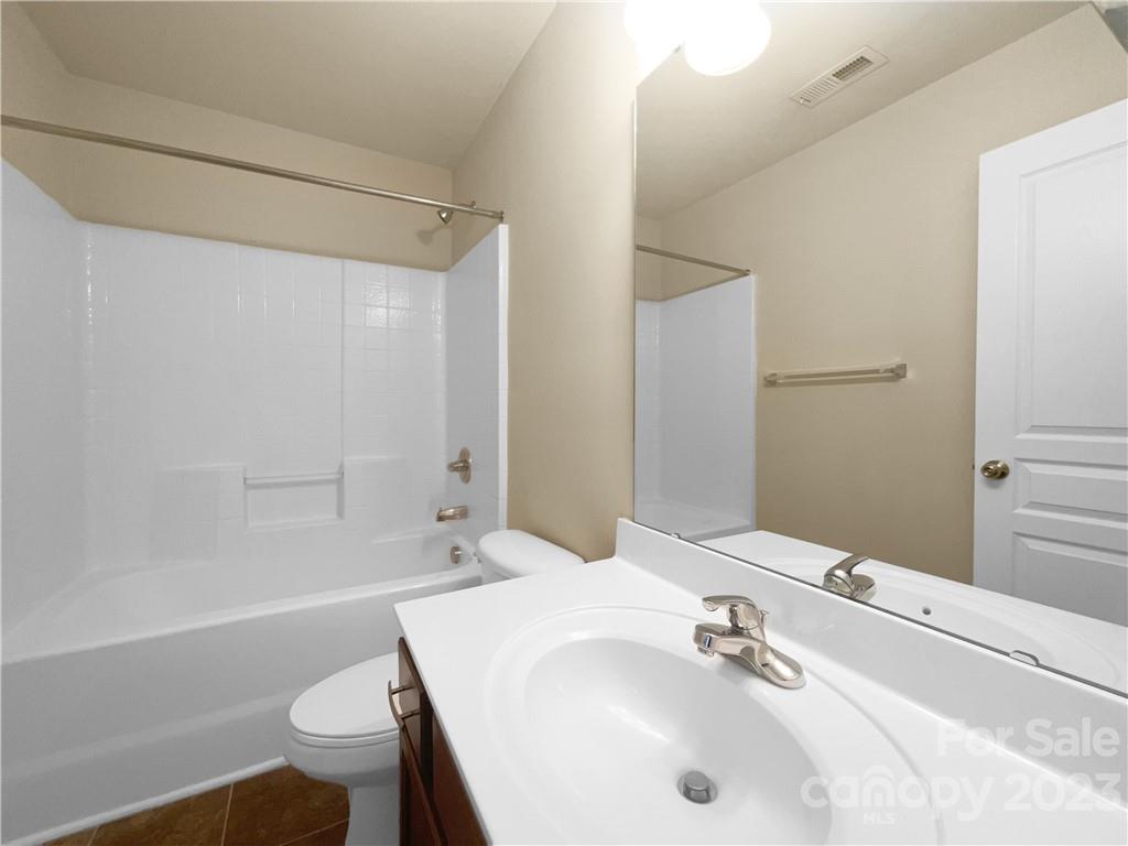 10775 Traders Court Davidson, NC 28036 - Photo 18 of 28 a bathroom with a sink and a mirror