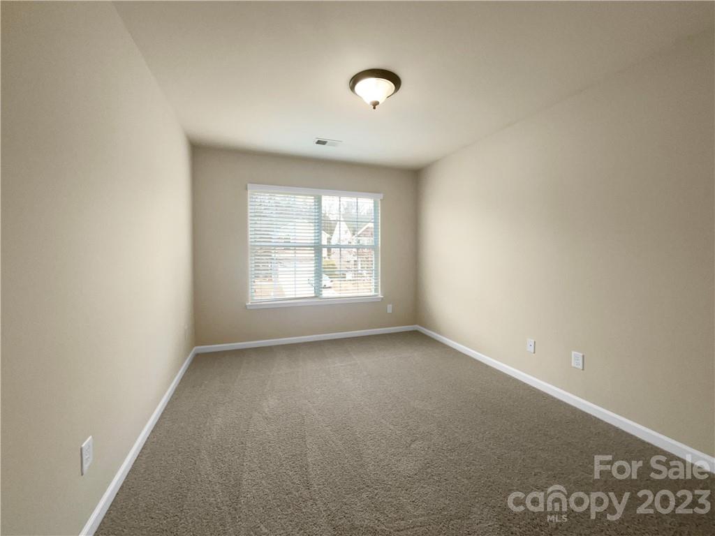 10775 Traders Court Davidson, NC 28036 - Photo 19 of 28 an empty room with a window