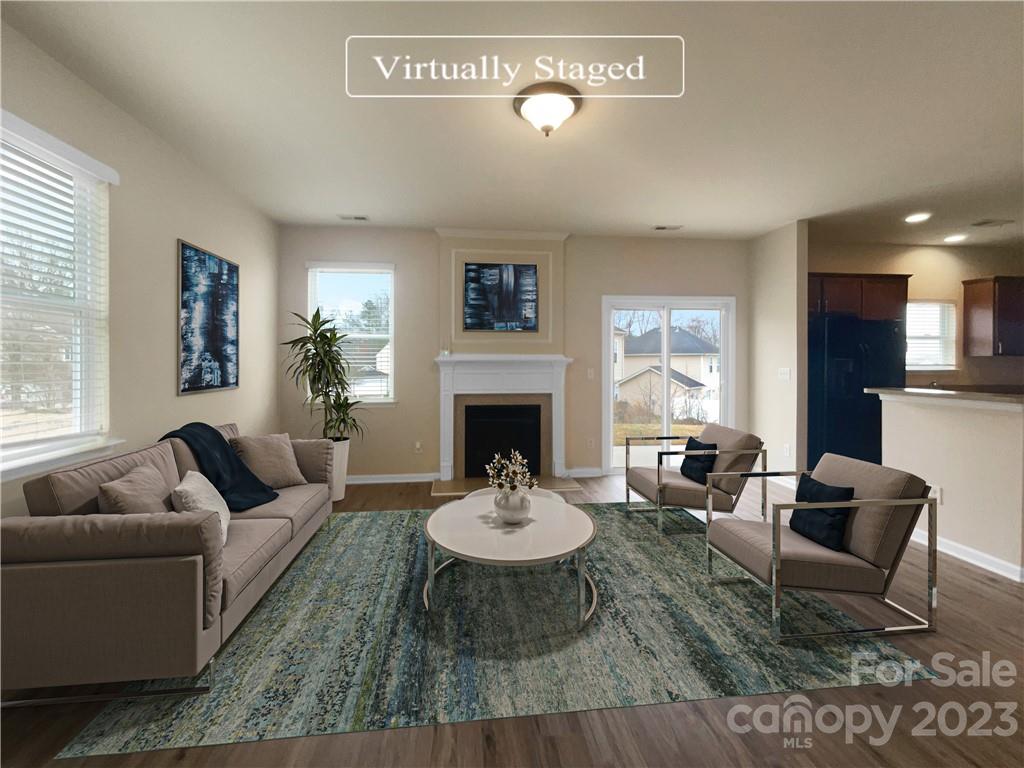 10775 Traders Court Davidson, NC 28036 - Photo 2 of 28 a living room with furniture and a fireplace