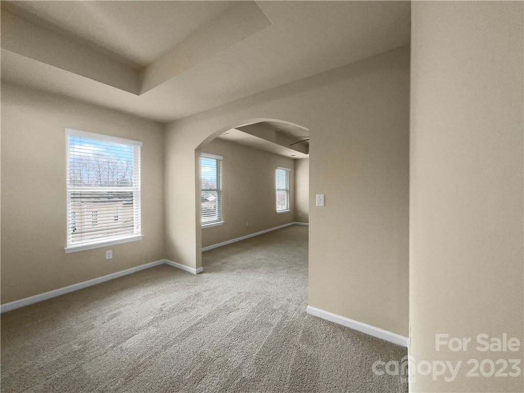 10775 Traders Court Davidson, NC 28036 - Photo 25 of 28 an empty room with windows and closet