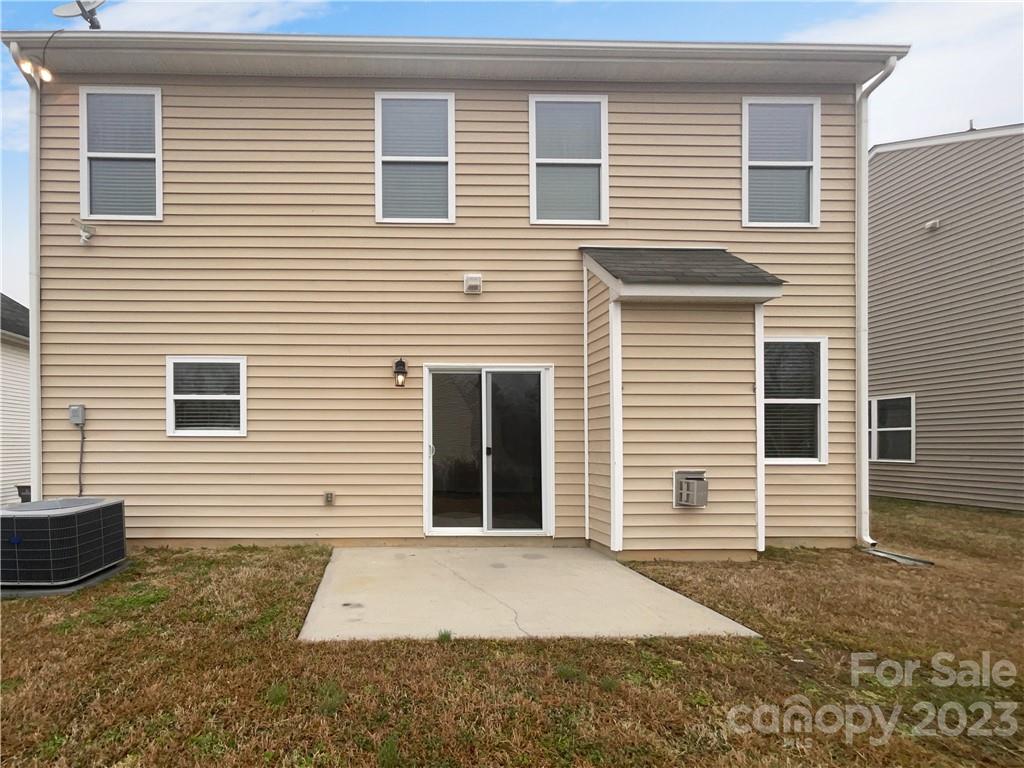 10775 Traders Court Davidson, NC 28036 - Photo 8 of 28 a view of a house with a yard and garage